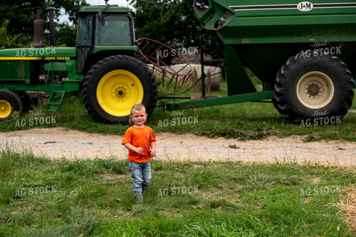 Farm Kid Walking by Tractor 115817