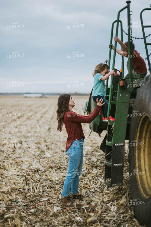 Farm Family Loading Kids into Combine 8627