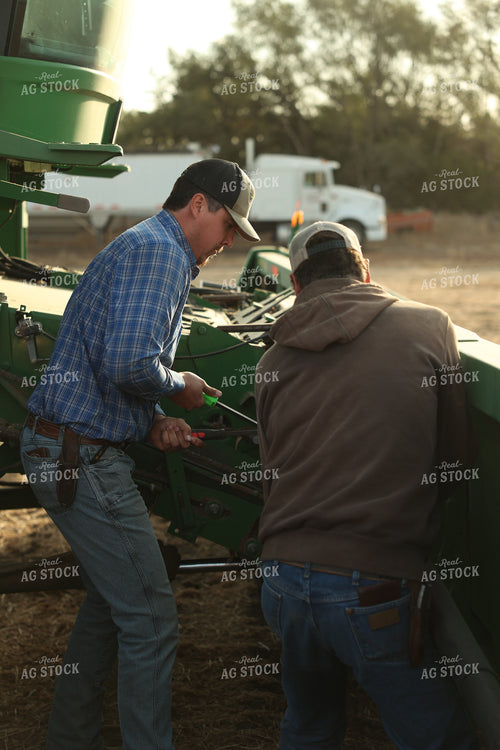 Farmers Fixing Combine 114108