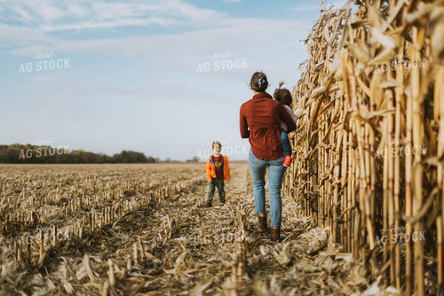 Female Farmer and Kids Checking Corn 8513