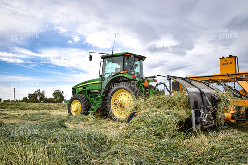 Tractor with Merger in Hay Field 56430