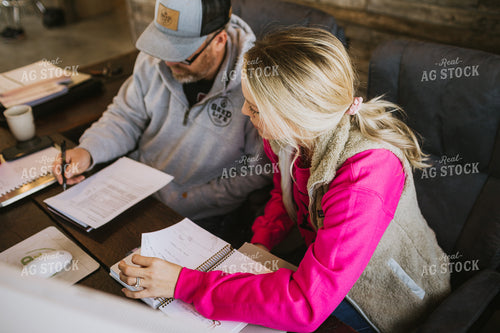 Man and Woman Going Over Paperwork 5344