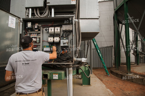 Farmer Fixing Grain Dryer 26018
