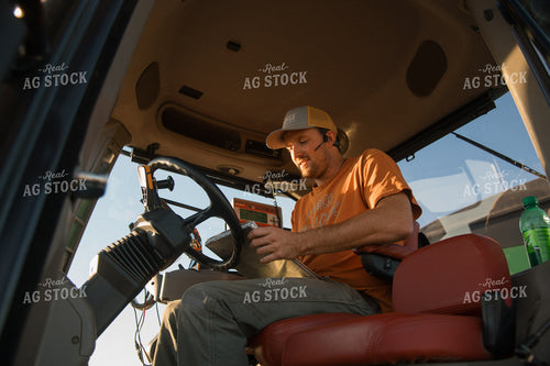 Farmer in Tractor 25997