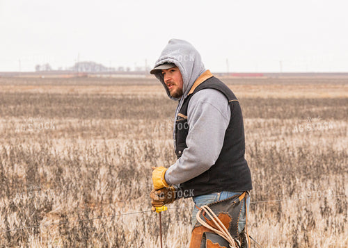 Rancher Fixing Fence 231063
