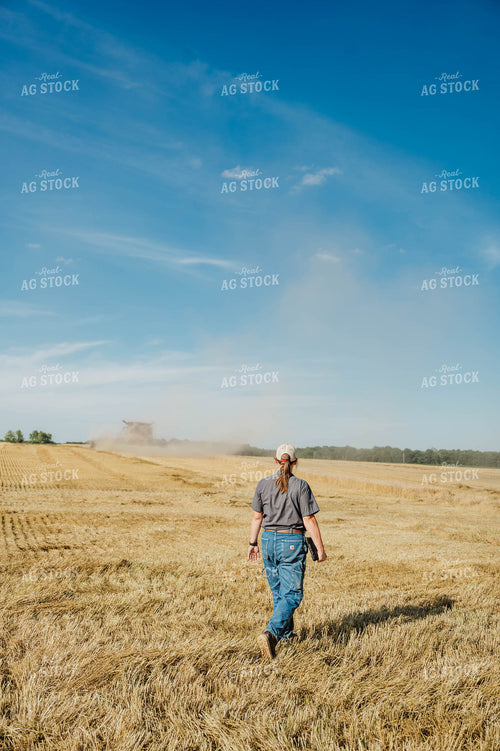 Female Farmer Walking in Field 115228