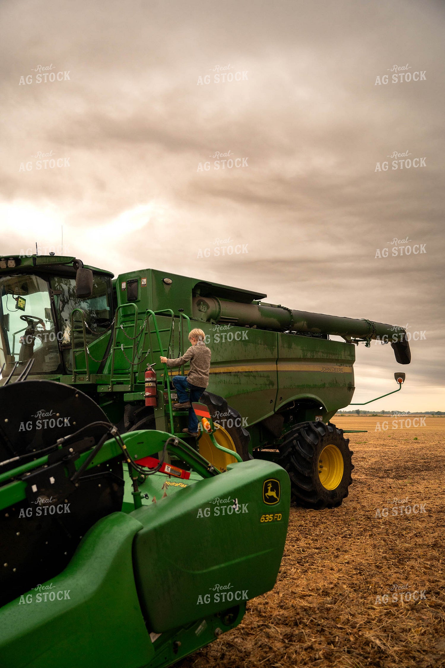 Farm Kid Climbing into Combine 115398