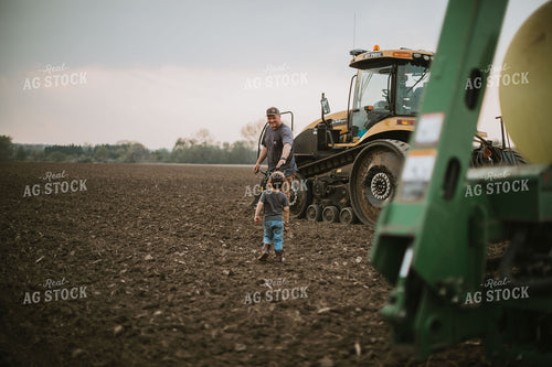 Farmer Walking Toward Planter Tractor with Farm Kid 5664