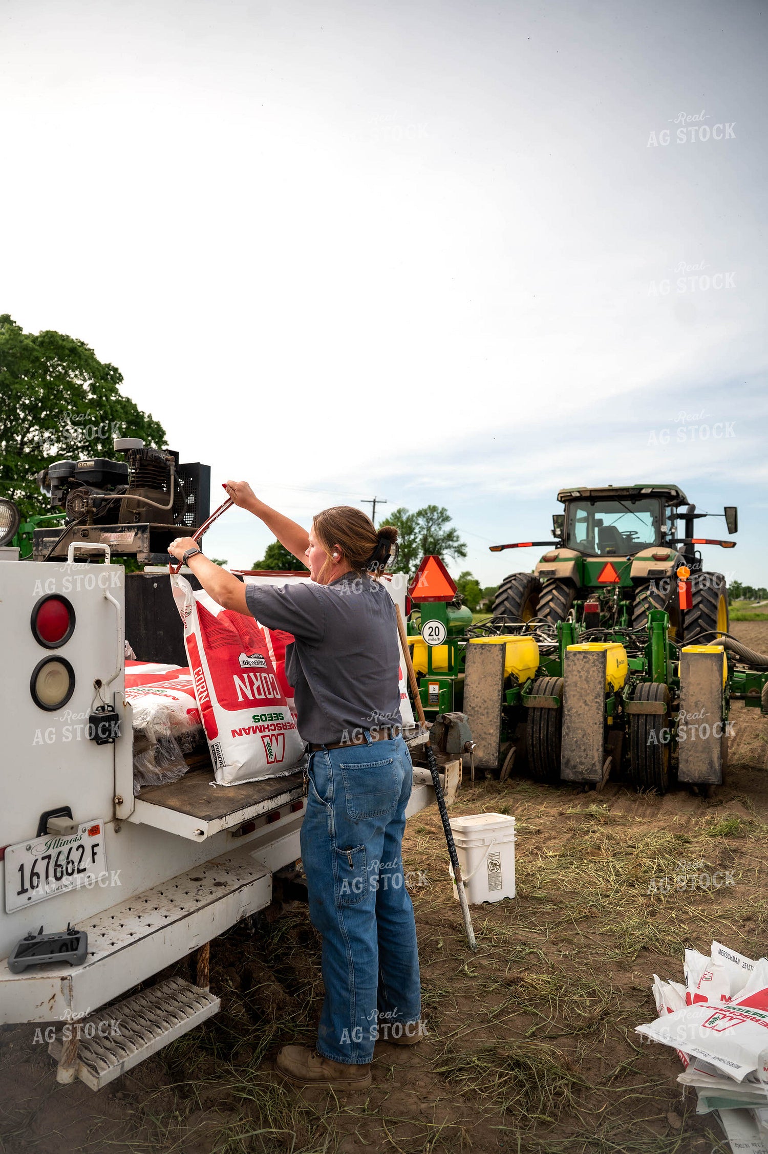Female Farmer Filling Planter 115624
