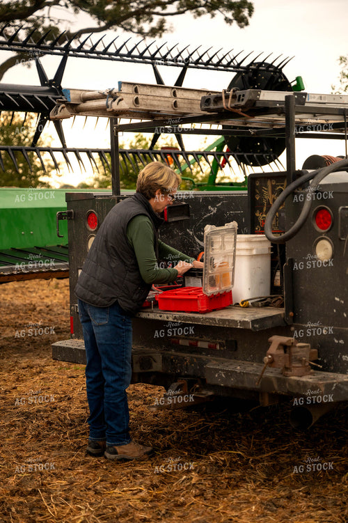 Female Farmer Getting Tools out of Service Truck 115406