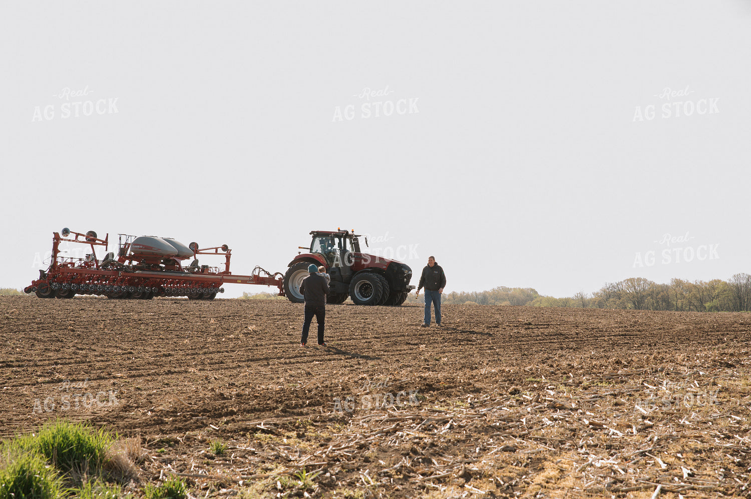 Farm Family in Field During Planting 26049