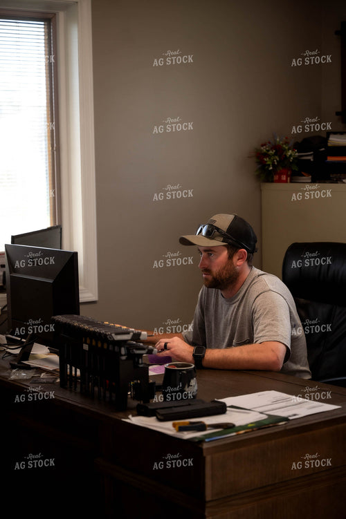 Farmer Working on Computer 115527