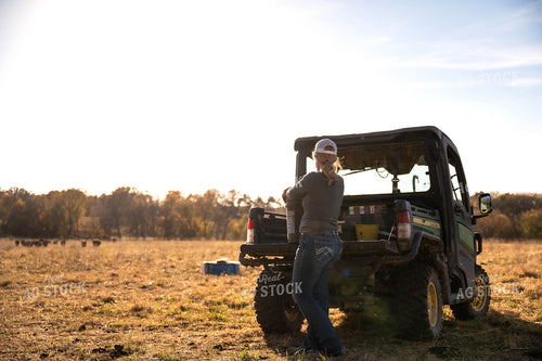 Female Farmer Feeding Cattle 115480
