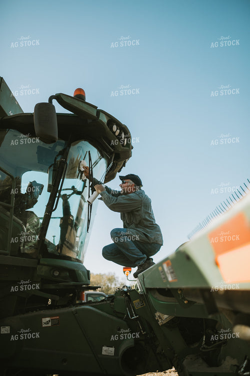 Farmer Cleaning Combine Windows 5223