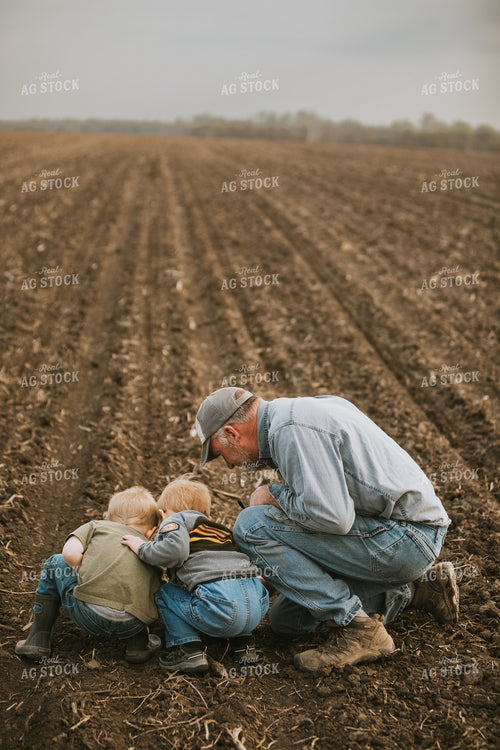 Farmer Checking Seed Depth with Farm Kids 5485