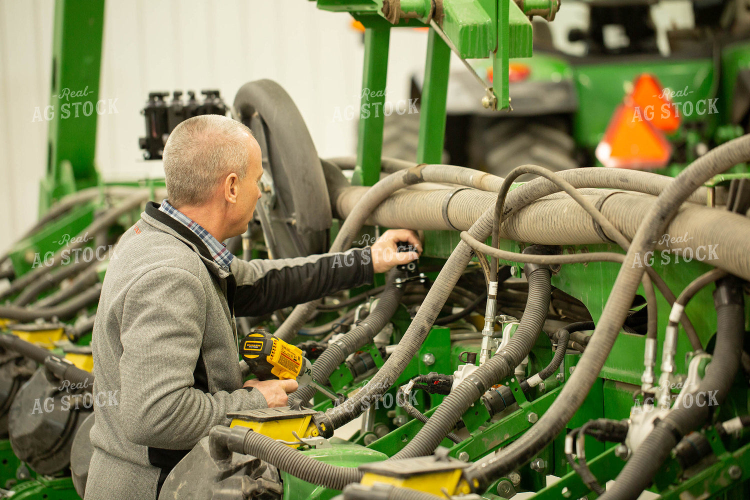 Farmer Fixing Planter 161142