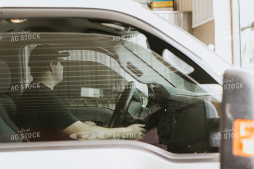 Farmer in Cab Parks Truck 7560