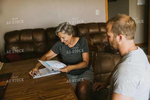Farm Family Doing Bookwork 8114