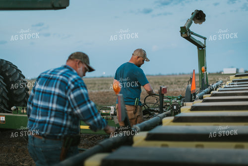 Farmers Working on Planter 7471