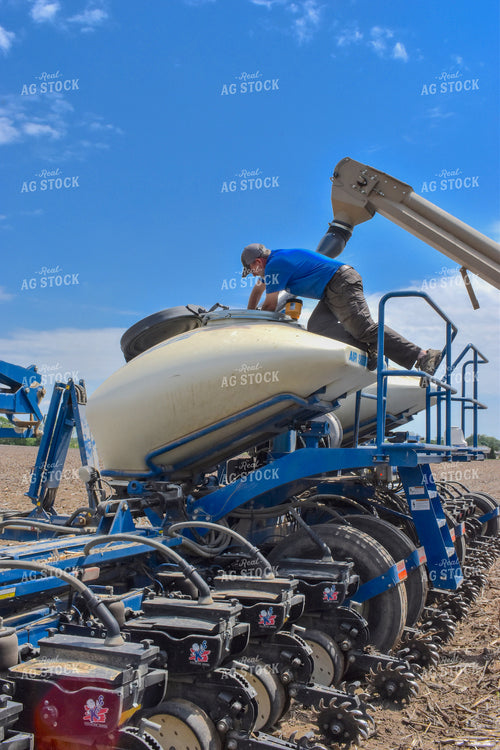 Farmer Checking Bulk Fill Planter 84077