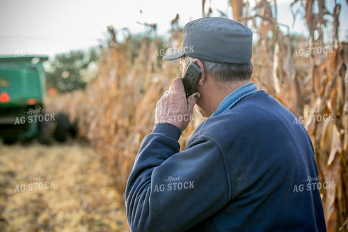 Farmer Talking on Phone in Field 250087