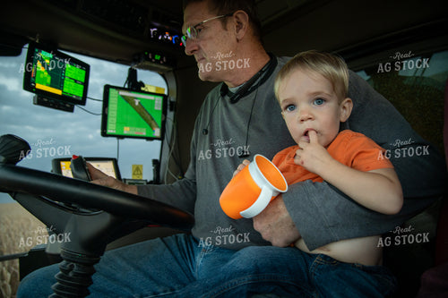 Grandson and Grandfather Farmer in the Combine Cab 25837
