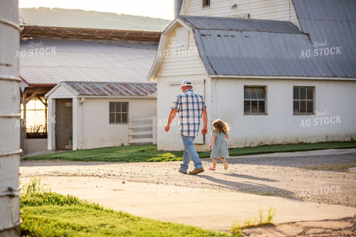 Farmer and Daughter Walking by Barns 270021