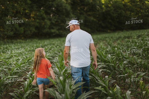 Farmer and Daugther Checking Corn 8744