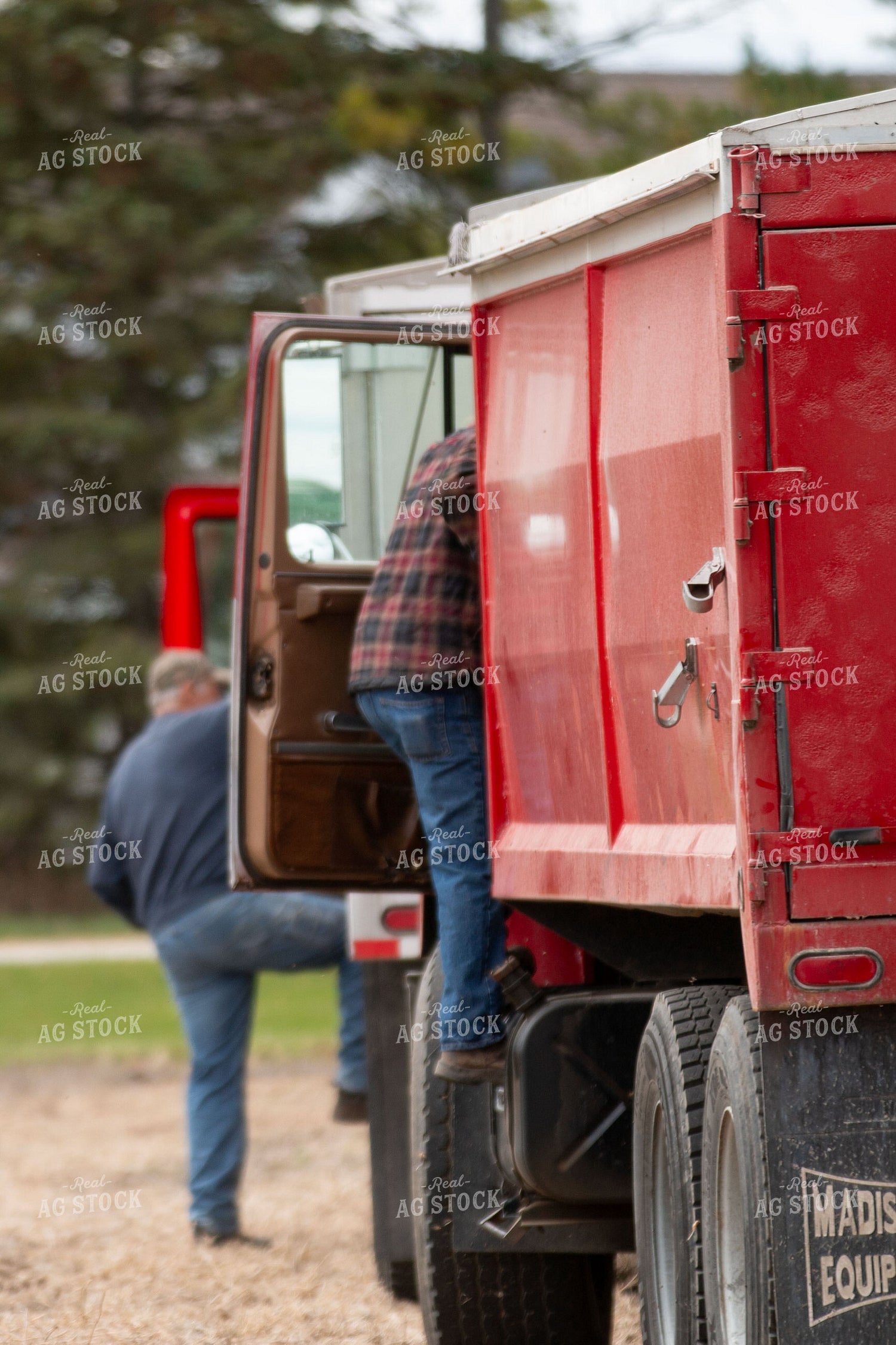 Farmers Climbing into Trucks 157102