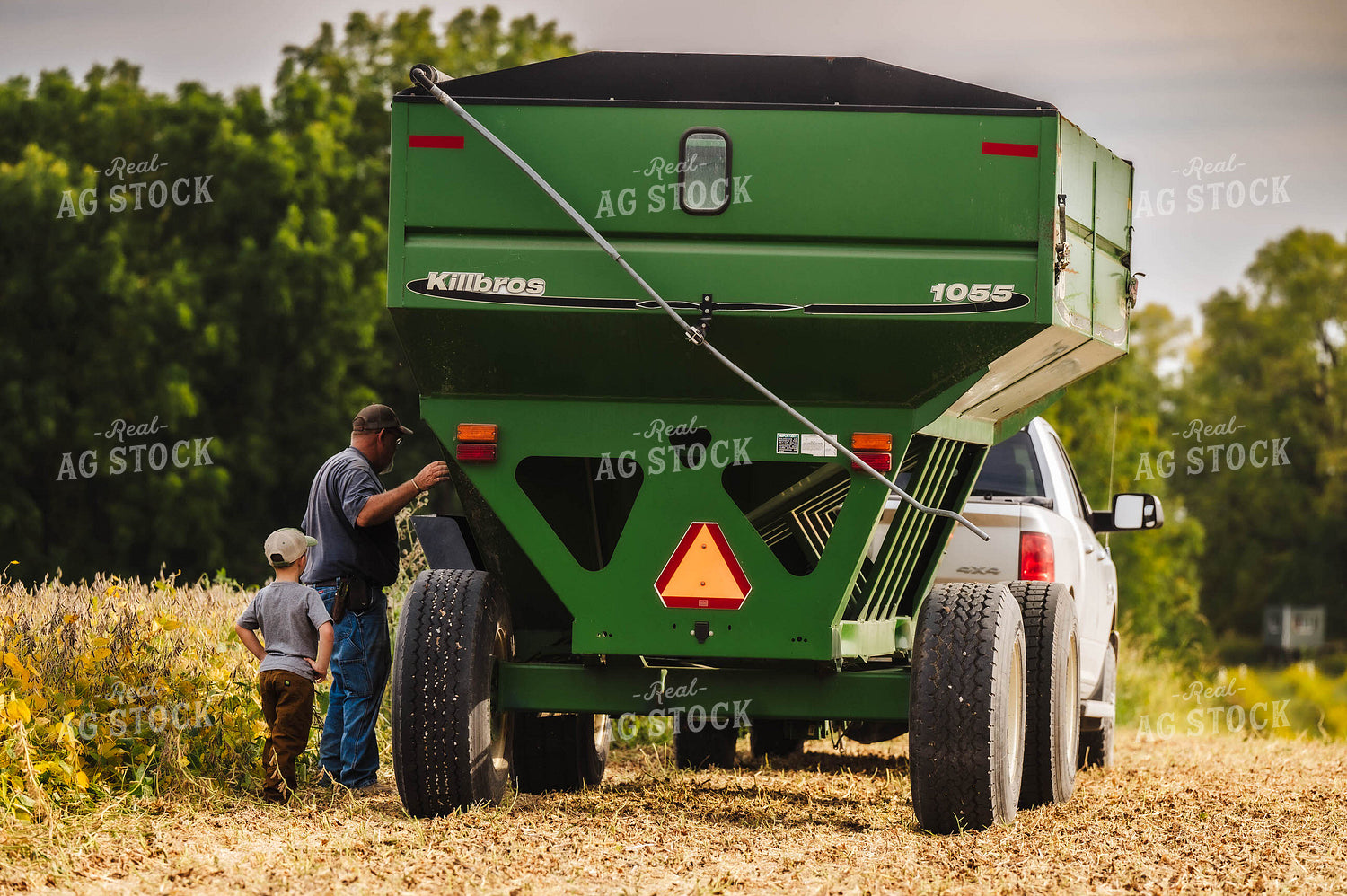 Farm Kid and Dad Working in the Field 115344
