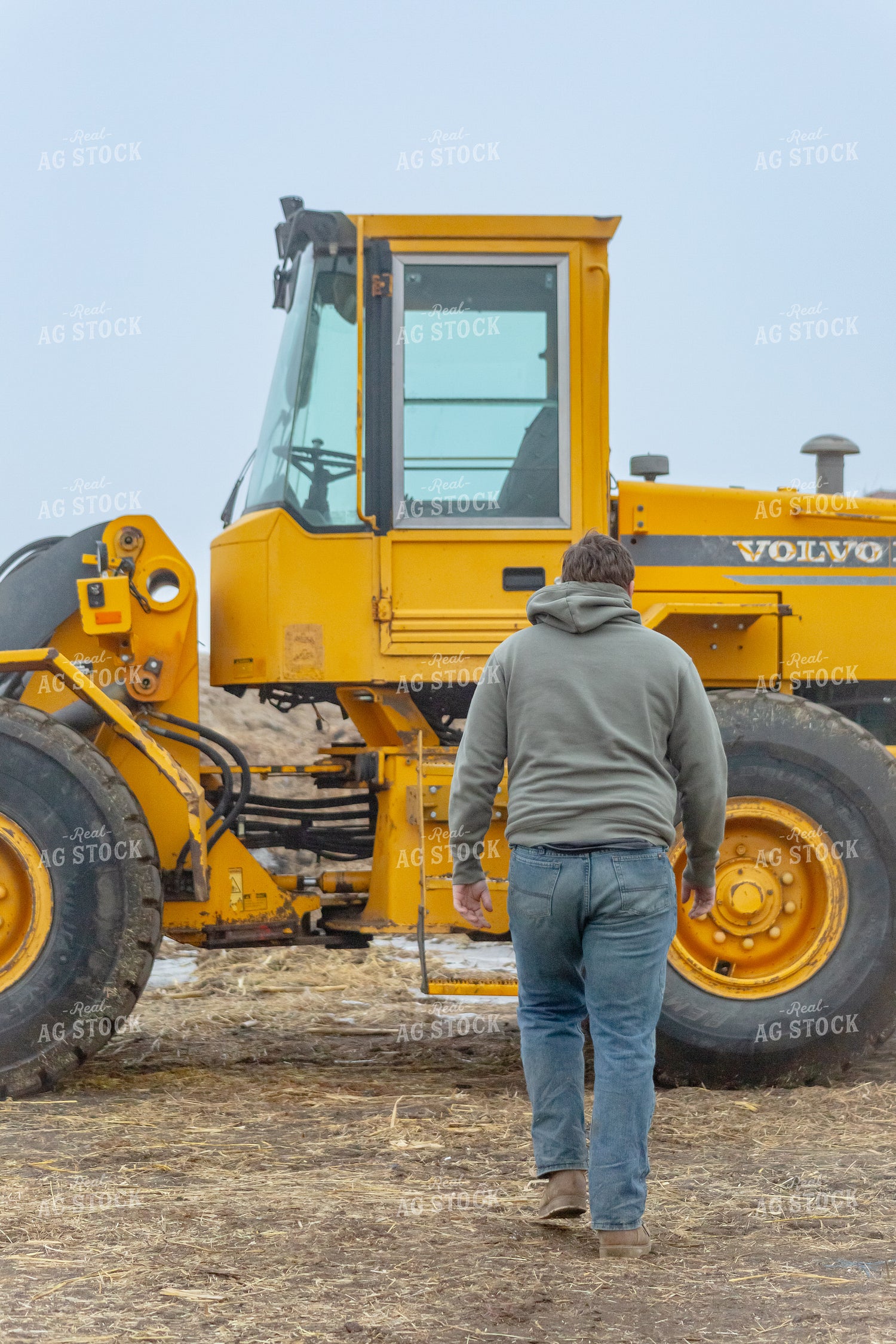 Rancher Walking to Equipment 155346
