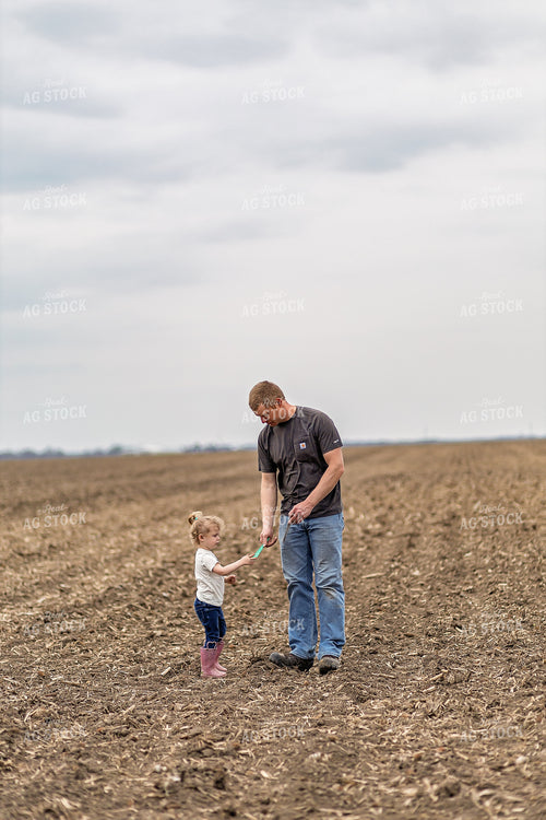 Farmer and Daughter Checking Soybeans 93313