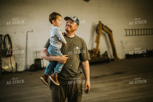 Farmer with Farm Kid in Shop 5135
