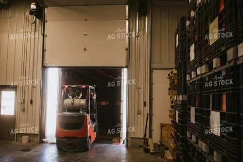 Forklift Operator Unloading Bulk Bins 5335