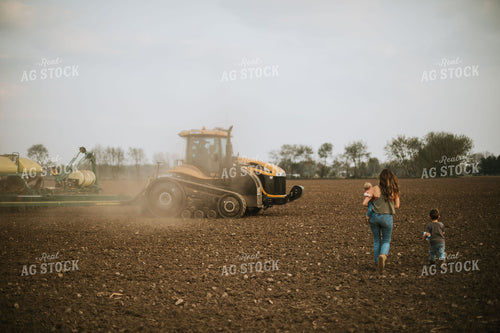 Farm Mom Taking Kids Out to Tractor During Planting 5638