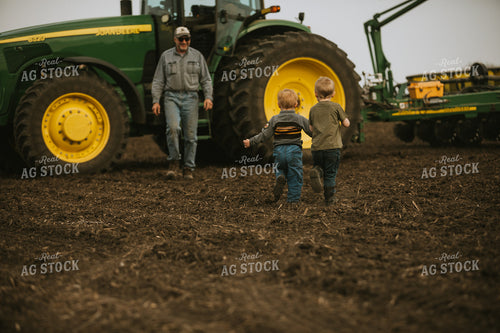 Farm Kids Running to Farmer in Field at Planting 5462