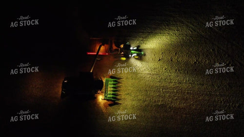 Aerial of Corn Harvest Combine Unloading at Dark 52587