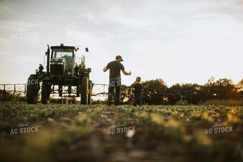 Farmer and Son in Field 6907