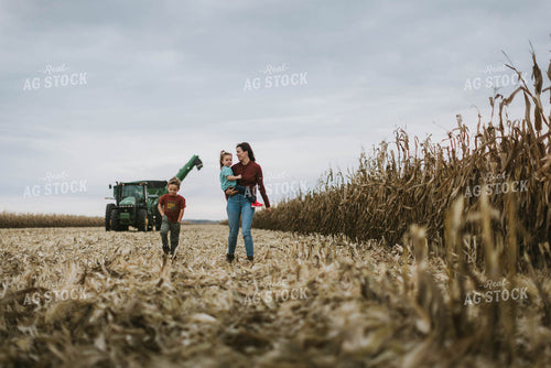 Female Farmer and Kids Walking Away from Tractor 8609
