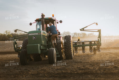 Farmer Getting into Tractor 7436