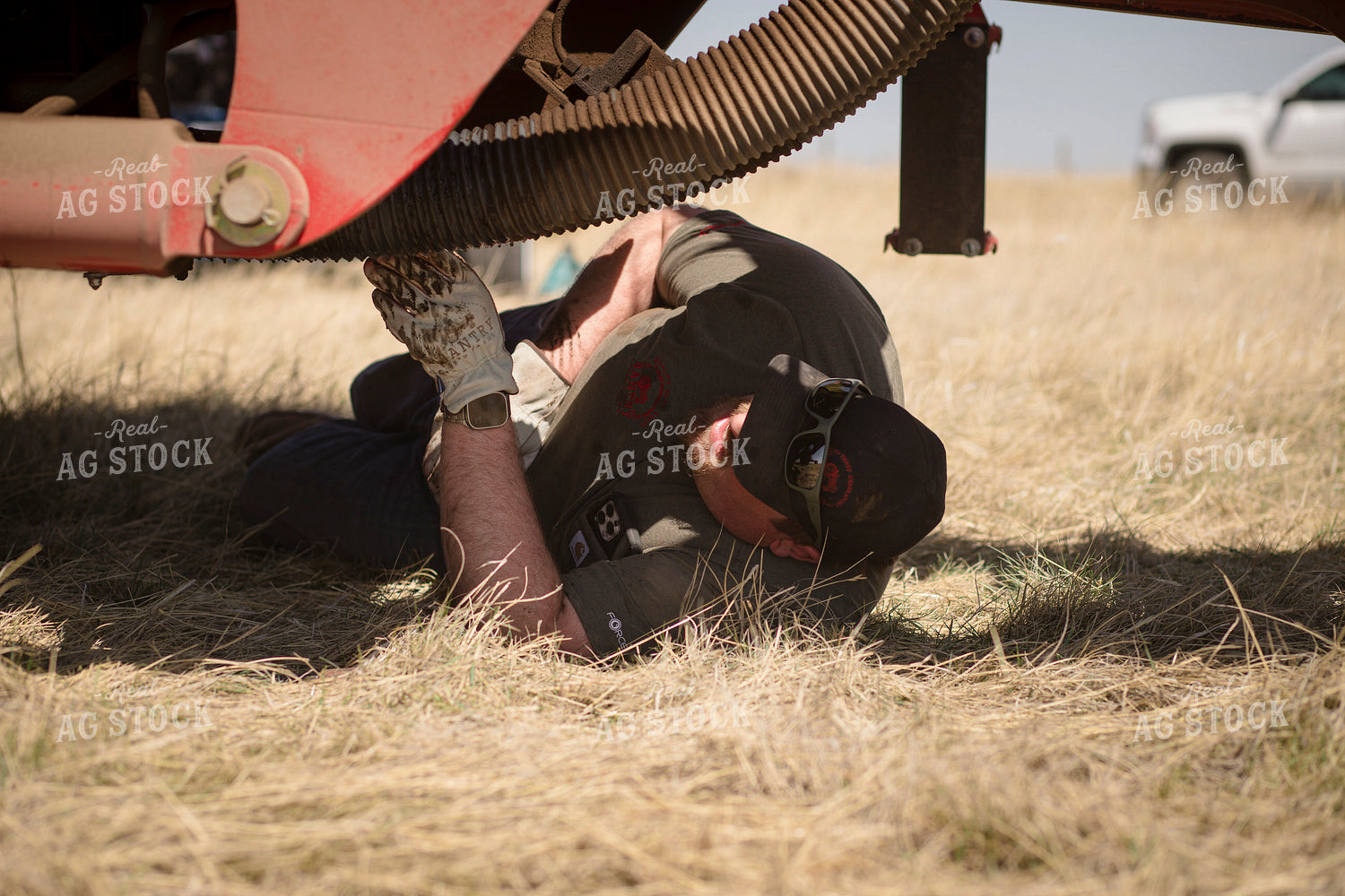 Farmer Working on Equipment 135078
