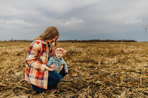 Farm Wife and Kid in Field 115154