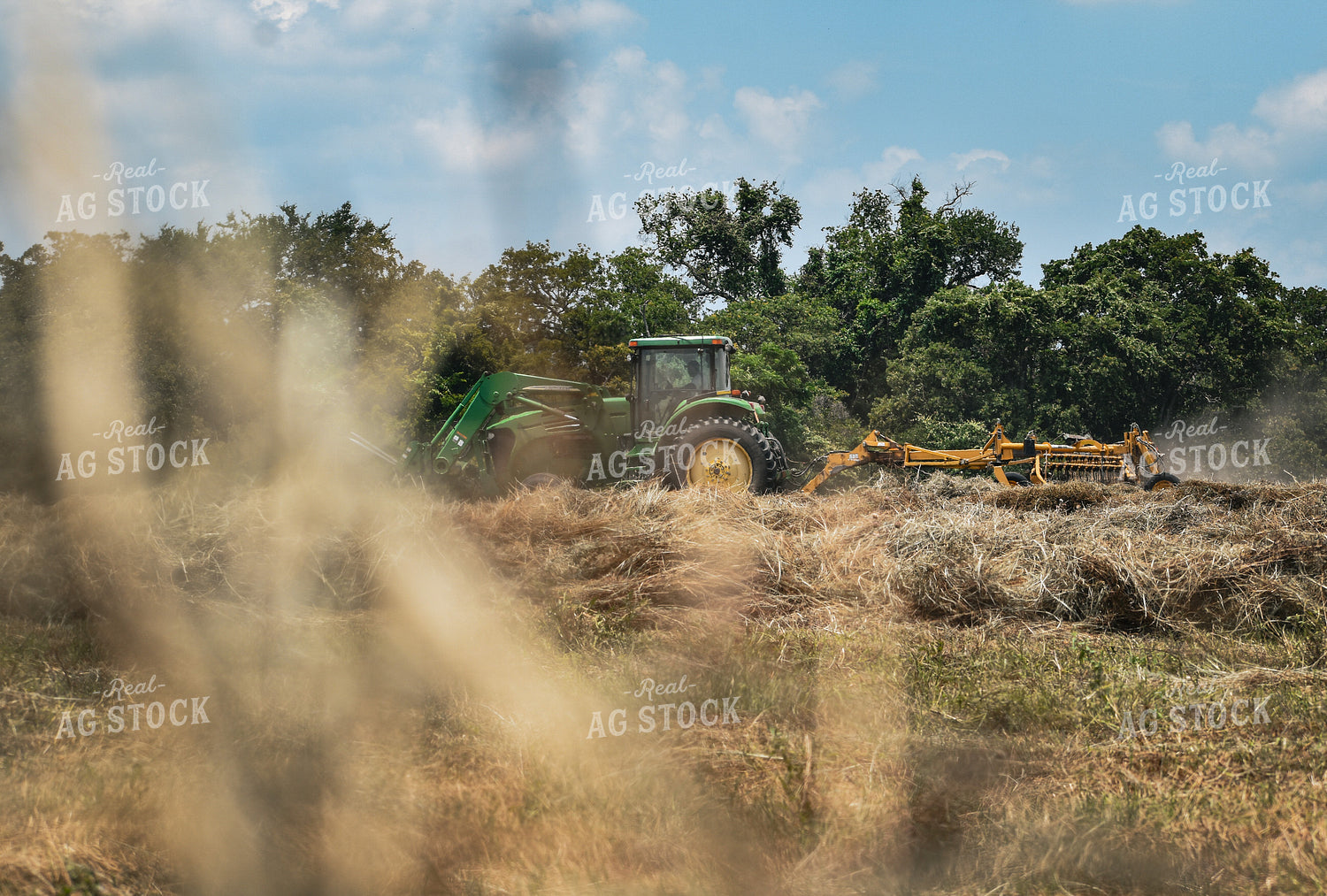 Front-End Loader Tractor Raking Hay 112015