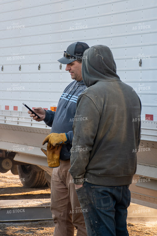Farmers Looking at Phone 50457