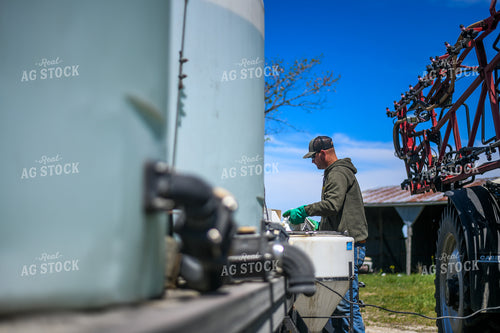 Farmer Mixing Chemicals for Self Propelled Sprayer 191063