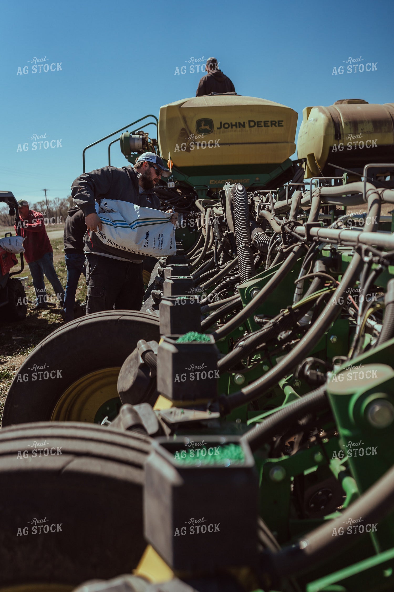 Farmer Filling Planter for Test Plot 196097