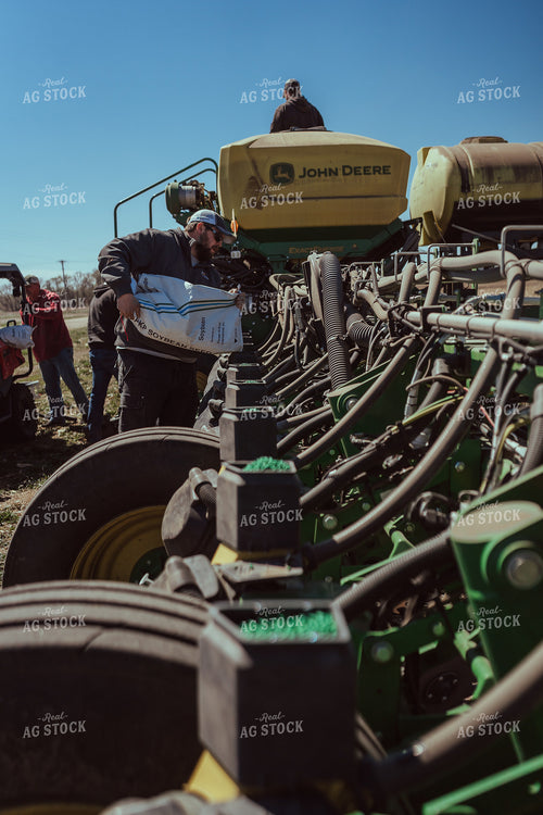 Farmer Filling Planter for Test Plot 196097