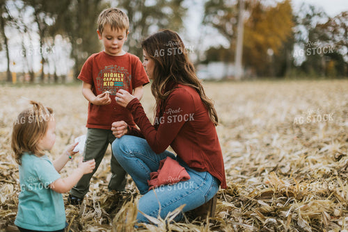 Female Farmer and Kids Playing in Cornfield 8613