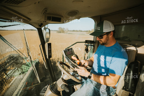 Farmer on Tablet in Combine 7113