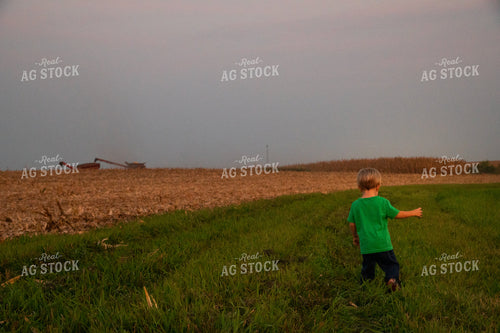Farm Kid Waiting to Ride in the Combine 25484